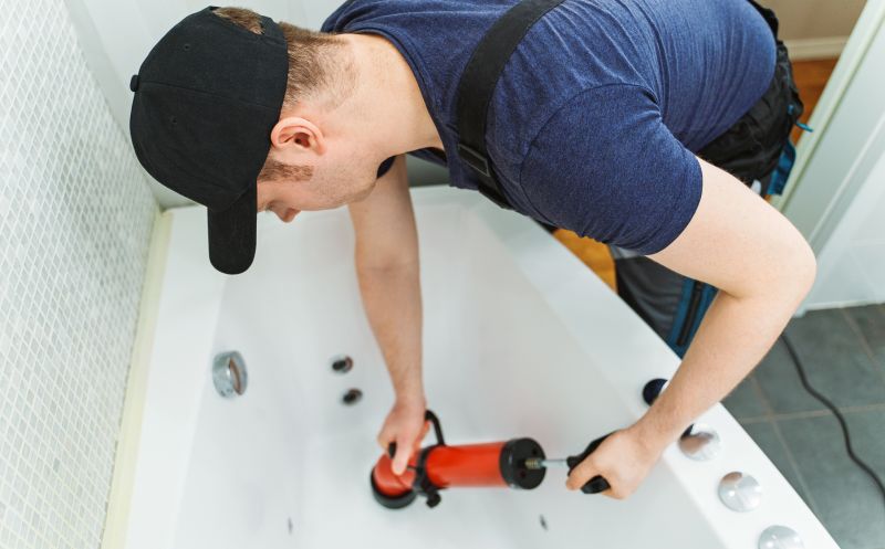 Professional bathtub installers at work